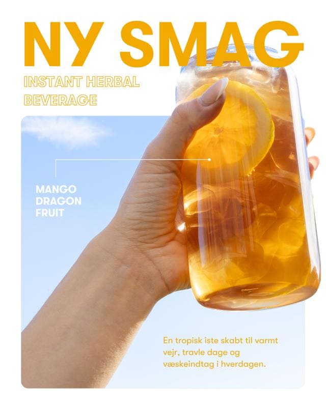 Mango Dragefrugt Instant Herbal Drink i Glas med skiver af citron.